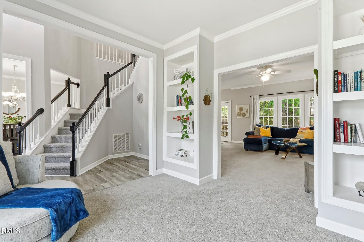 4001 Batiste Road Raleigh, NC 27613 - Photo 10 of 63 a view of livingroom with furniture and staircase