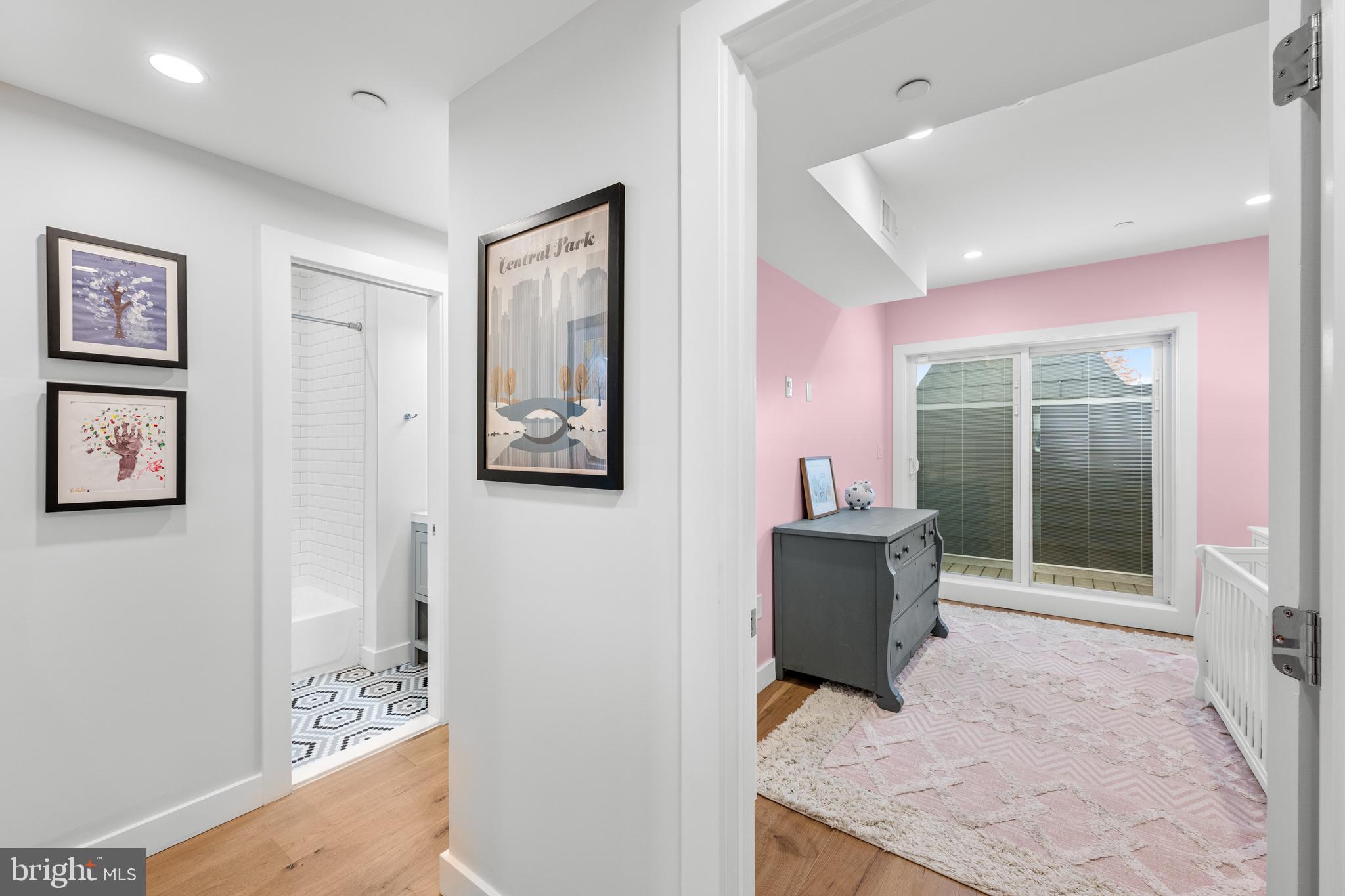 127 R Street Northeast, Unit 2 Washington, DC 20002 - Photo 19 of 31 a hallway with furniture and a large window
