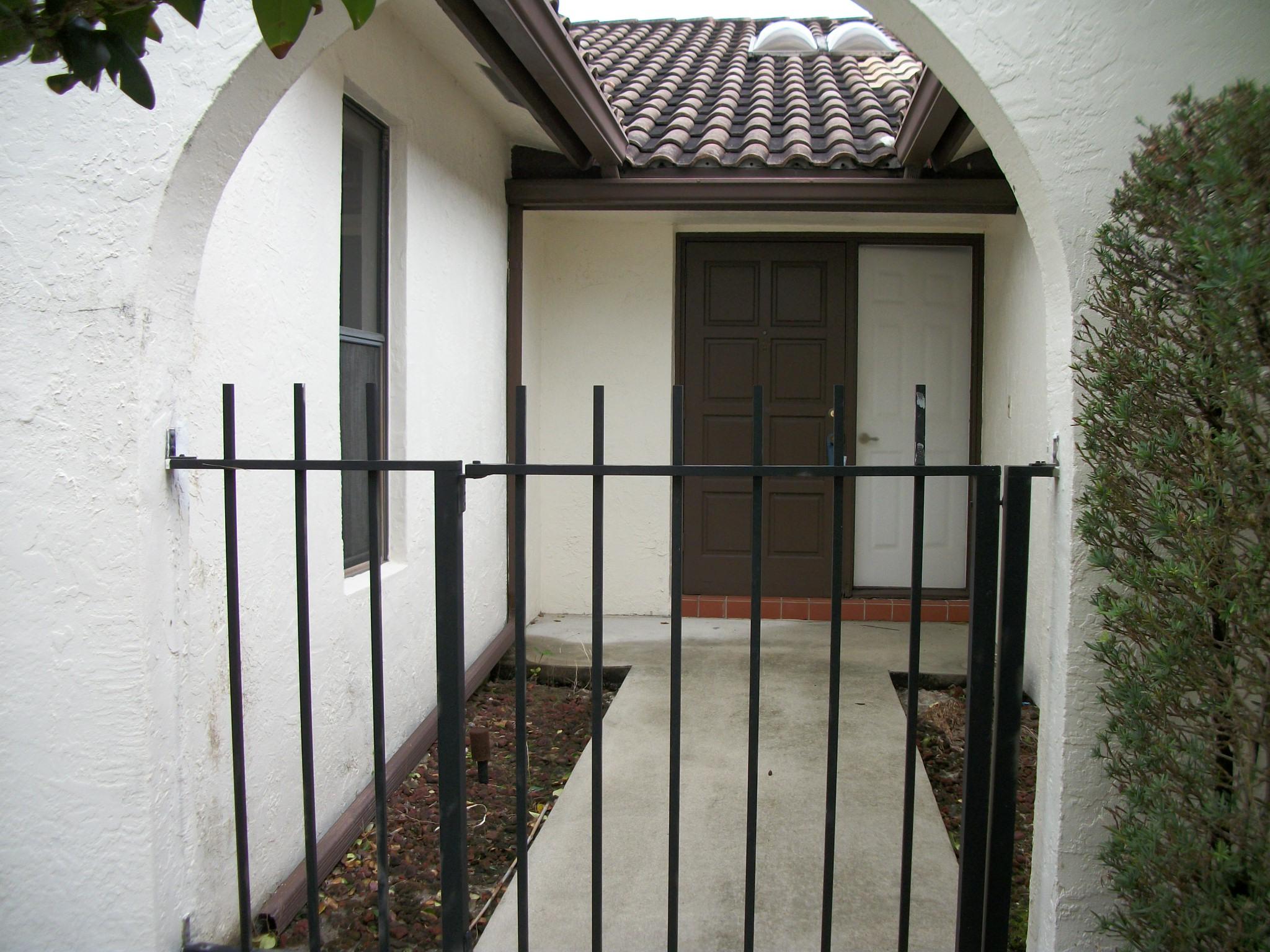 7606 Solimar Circle Boca Raton, FL 33433 - Photo 3 of 31 Courtyard Entrance