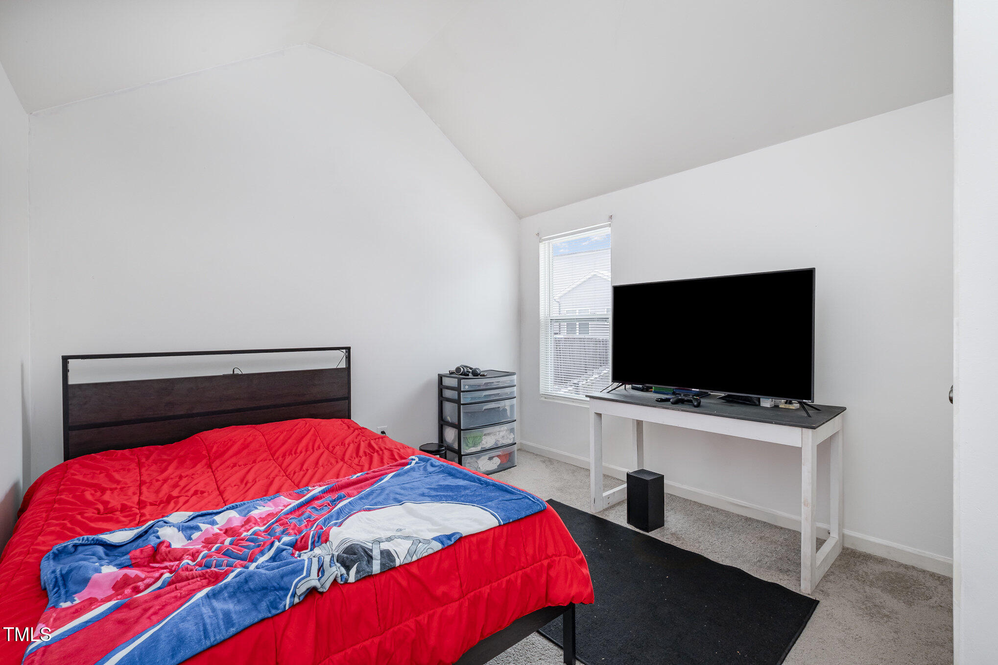 5627 Quitman Trail Raleigh, NC 27610 - Photo 17 of 26 a bedroom with a bed and a flat screen tv