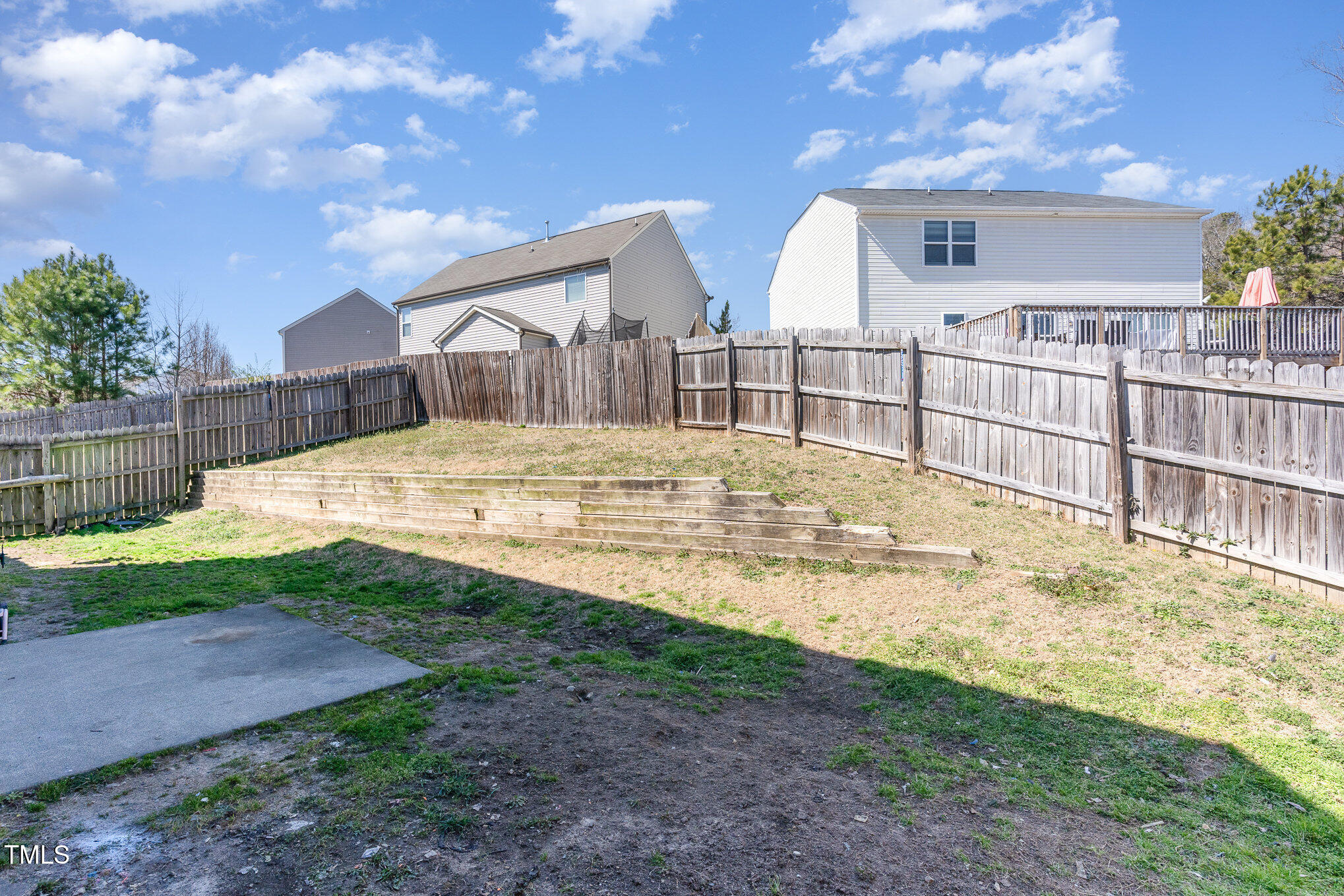5627 Quitman Trail Raleigh, NC 27610 - Photo 23 of 26 a view of an house with backyard and trees