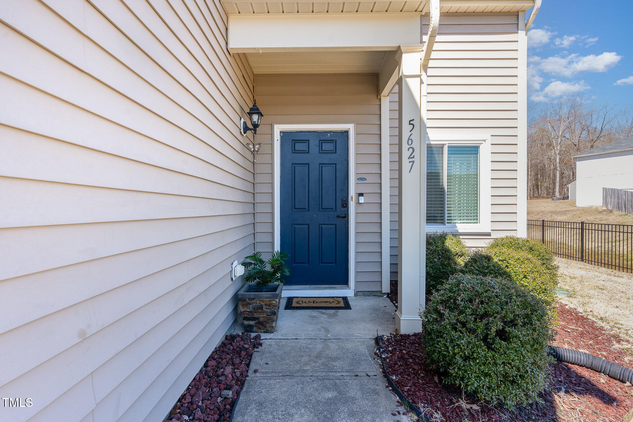 5627 Quitman Trail Raleigh, NC 27610 - Photo 3 of 26 a front view of a house with a garden