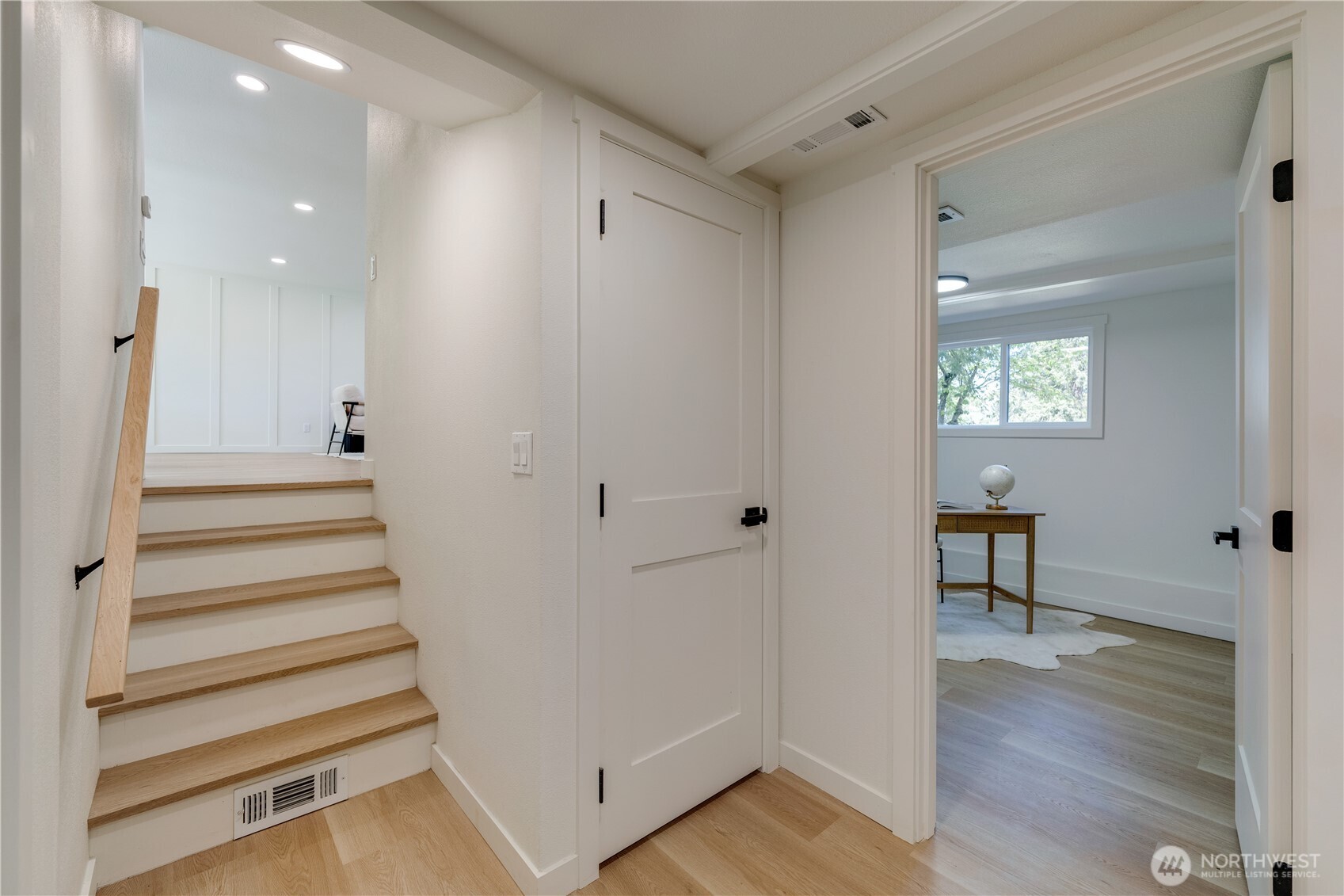 416 221st Street Southwest Bothell, WA 98021 - Photo 14 of 40 a view of a hallway with wooden floor and entryway