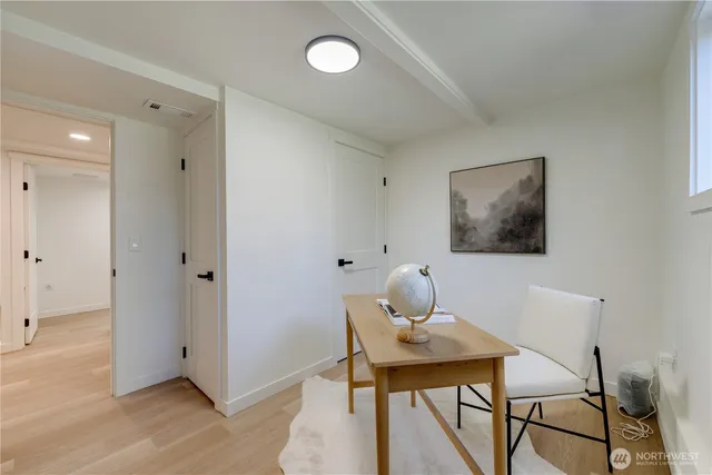 a workspace with furniture and window