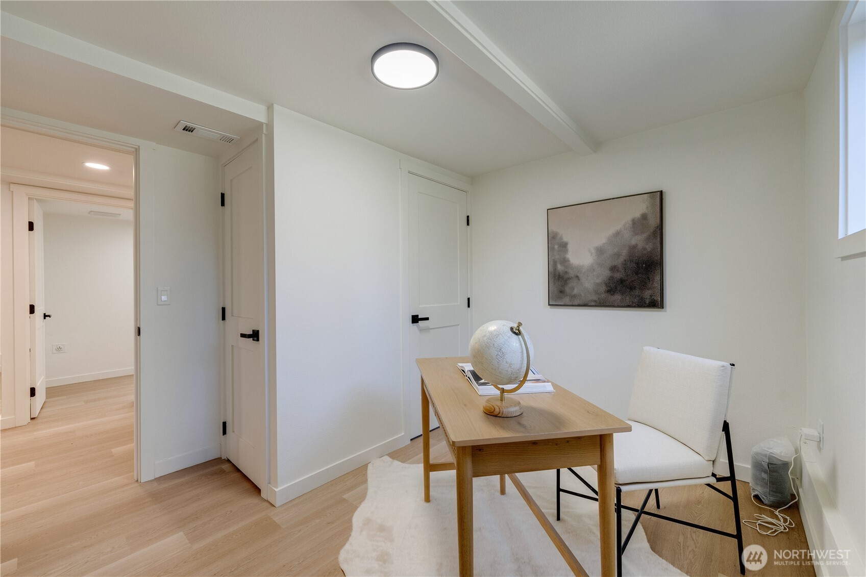 416 221st Street Southwest Bothell, WA 98021 - Photo 15 of 40 a view of a workspace with furniture and wooden floor