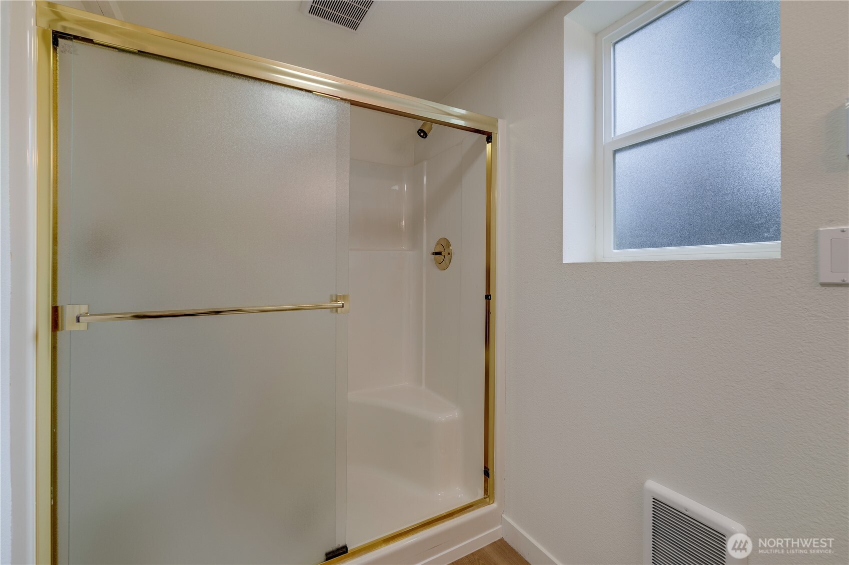416 221st Street Southwest Bothell, WA 98021 - Photo 21 of 40 a bathroom with a glass shower door