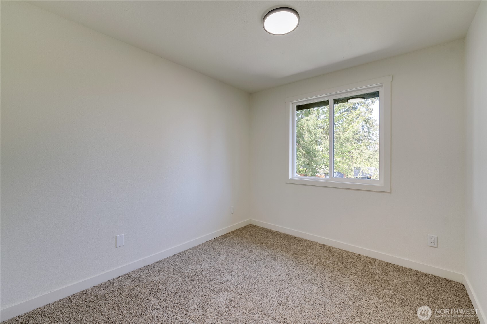 416 221st Street Southwest Bothell, WA 98021 - Photo 24 of 40 an empty room with a window
