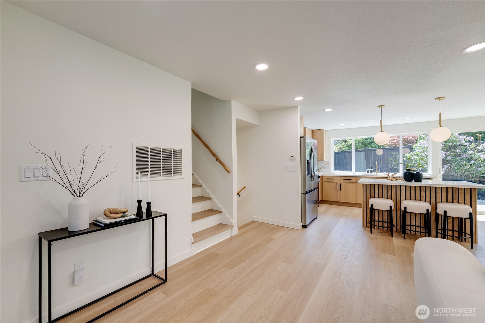 416 221st Street Southwest Bothell, WA 98021 - Photo 5 of 40 a view of living room kitchen with furniture and wooden floor