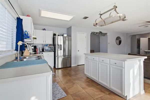 a bathroom with a sink a large mirror and a shower