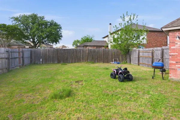 a view of a backyard with a garden and plants