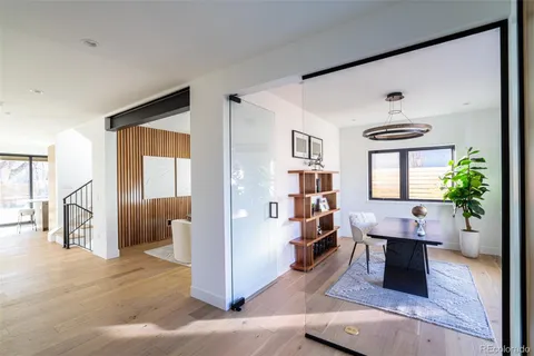 a view of a livingroom with furniture window and wooden floor