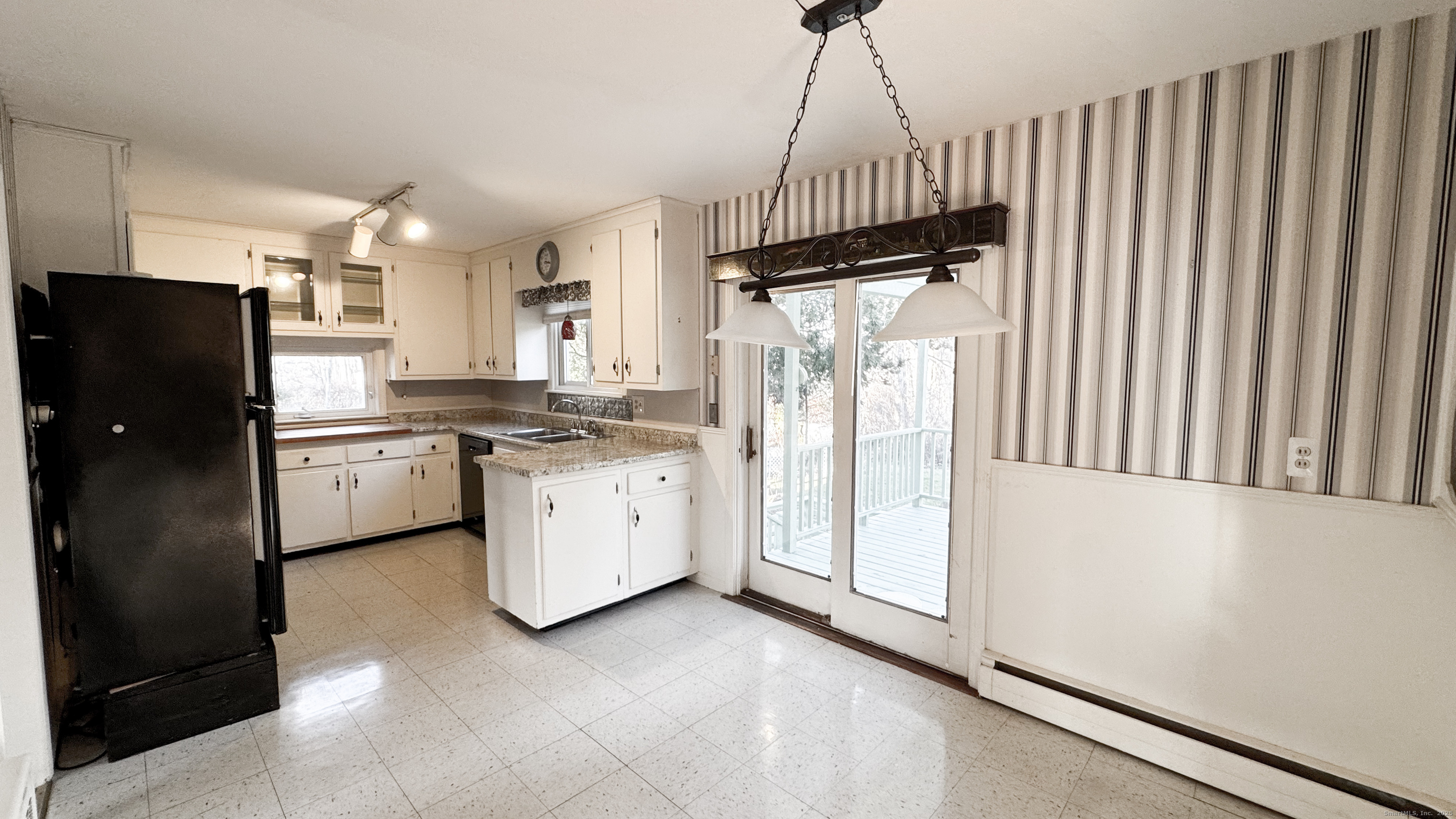 338 Main Street Hampton, CT 06247 - Photo 16 of 31 a kitchen with a refrigerator a sink and dishwasher