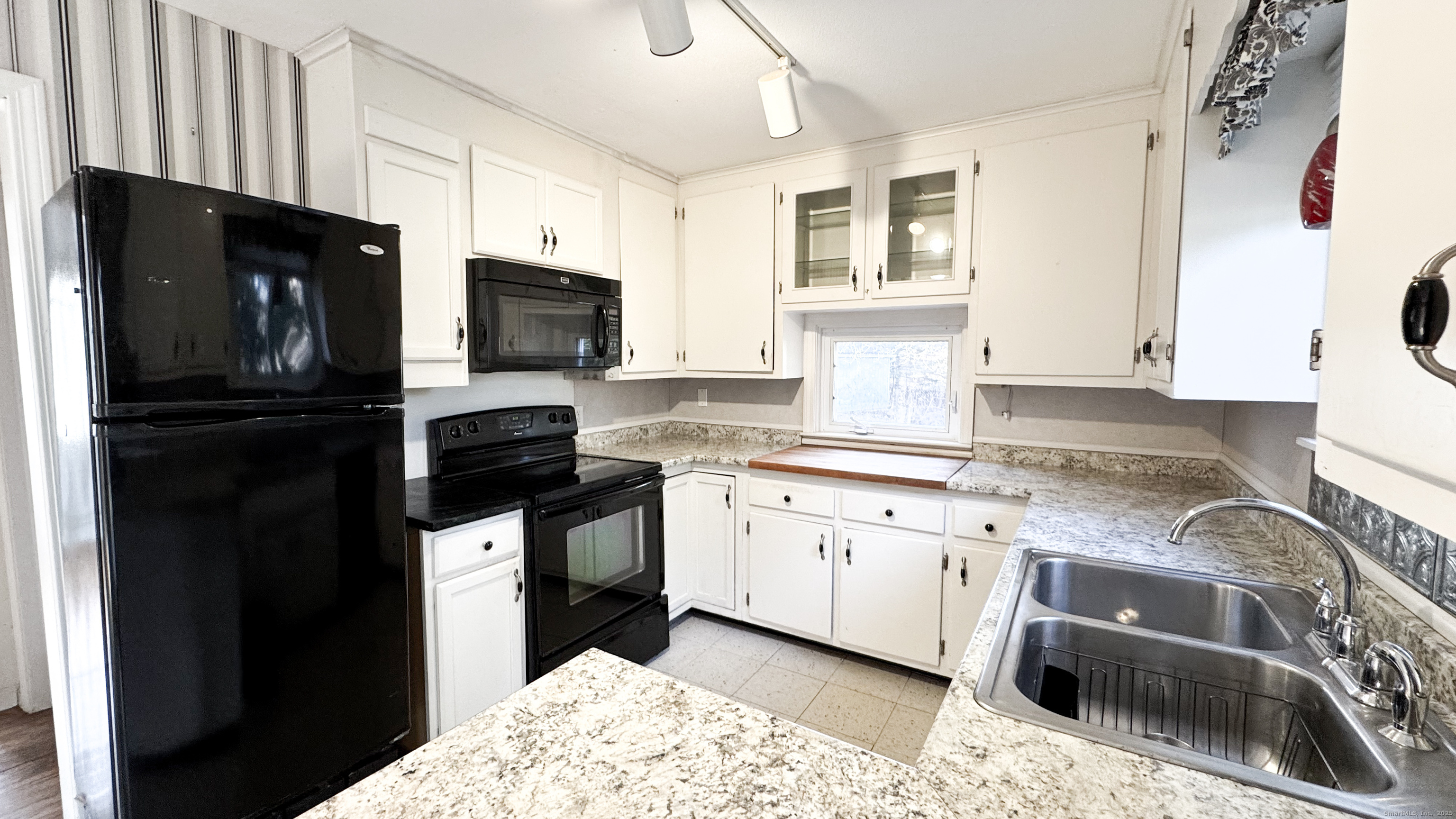 338 Main Street Hampton, CT 06247 - Photo 17 of 31 a kitchen with stainless steel appliances granite countertop a stove a sink and a microwave