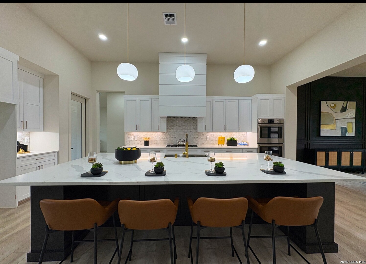 11010 Nina Ridge San Antonio, TX 78255 - Photo 14 of 44 a kitchen with granite countertop a sink and chairs
