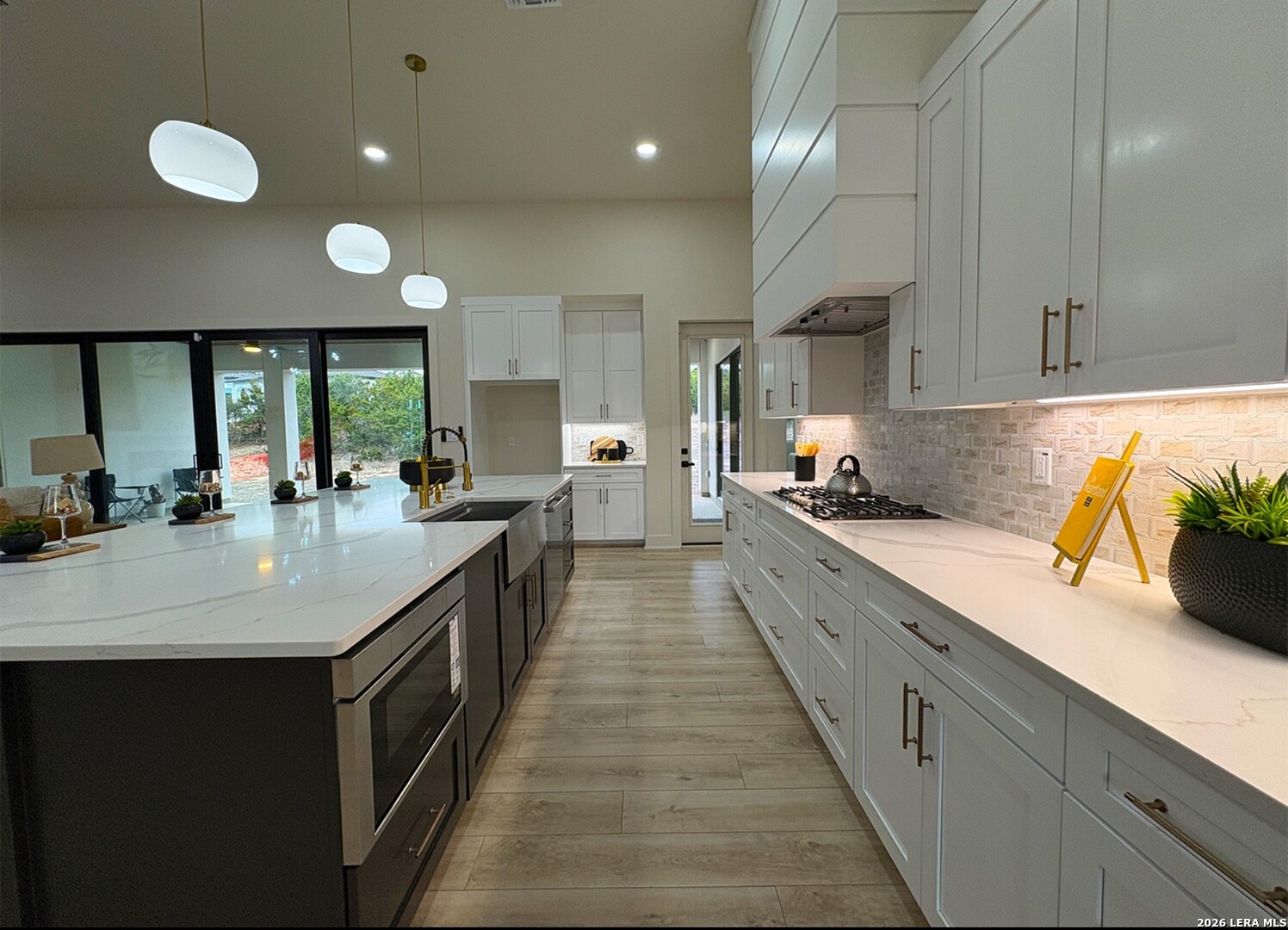 11010 Nina Ridge San Antonio, TX 78255 - Photo 15 of 44 a large kitchen with kitchen island a sink stainless steel appliances and cabinets