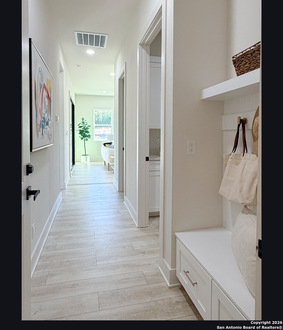 11010 Nina Ridge San Antonio, TX 78255 - Photo 19 of 44 a view of a bathroom from the hallway