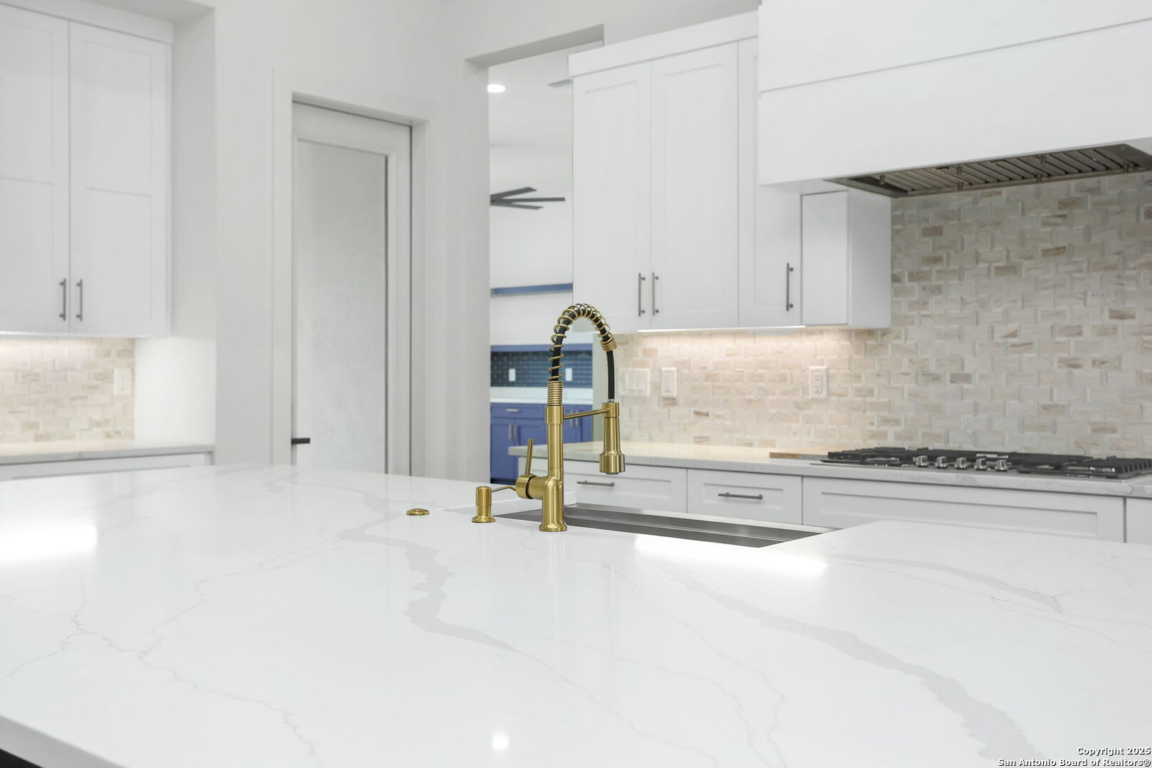 11010 Nina Ridge San Antonio, TX 78255 - Photo 22 of 44 a kitchen with a sink and cabinets
