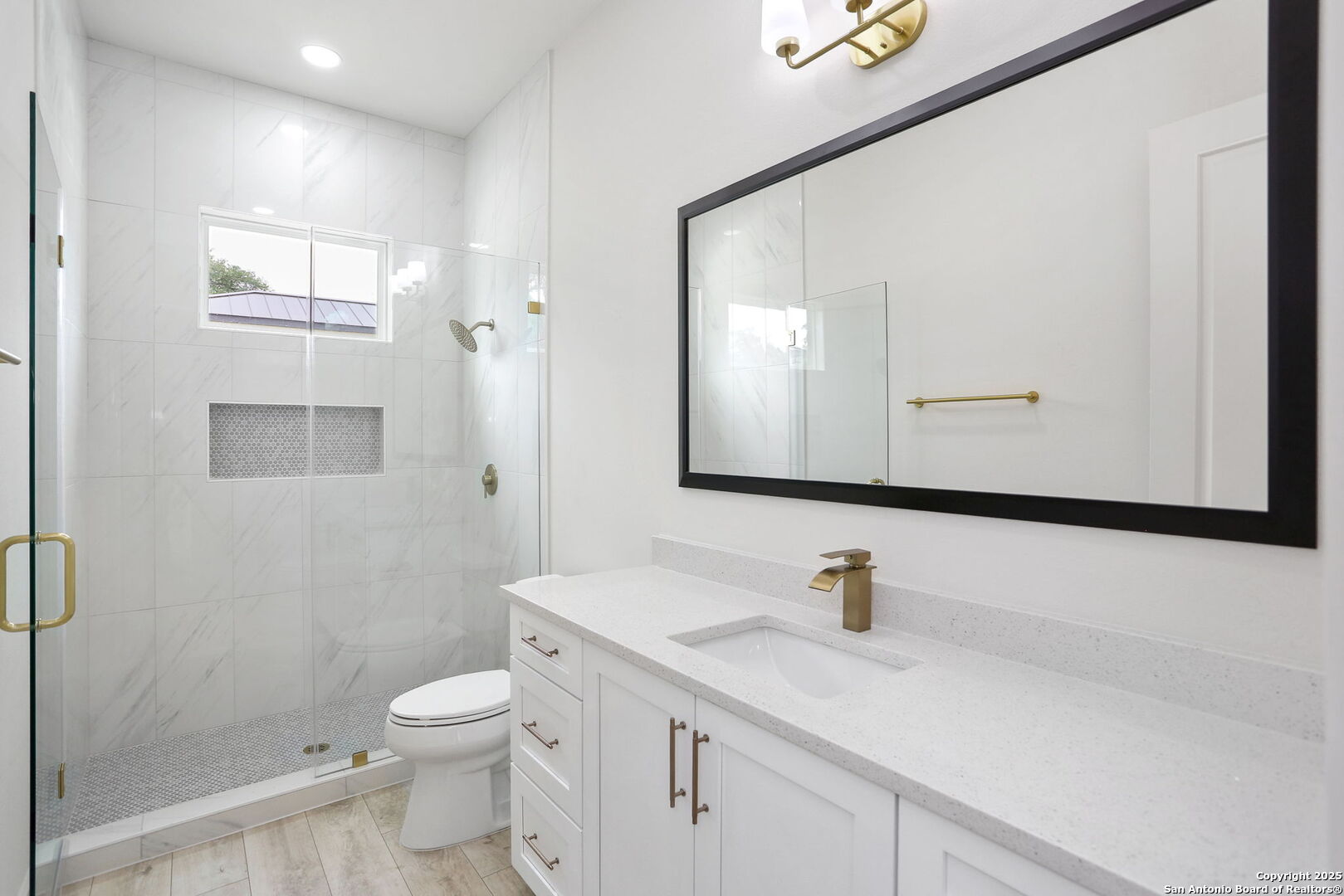 11010 Nina Ridge San Antonio, TX 78255 - Photo 24 of 44 a bathroom with a sink vanity granite toilet and a mirror