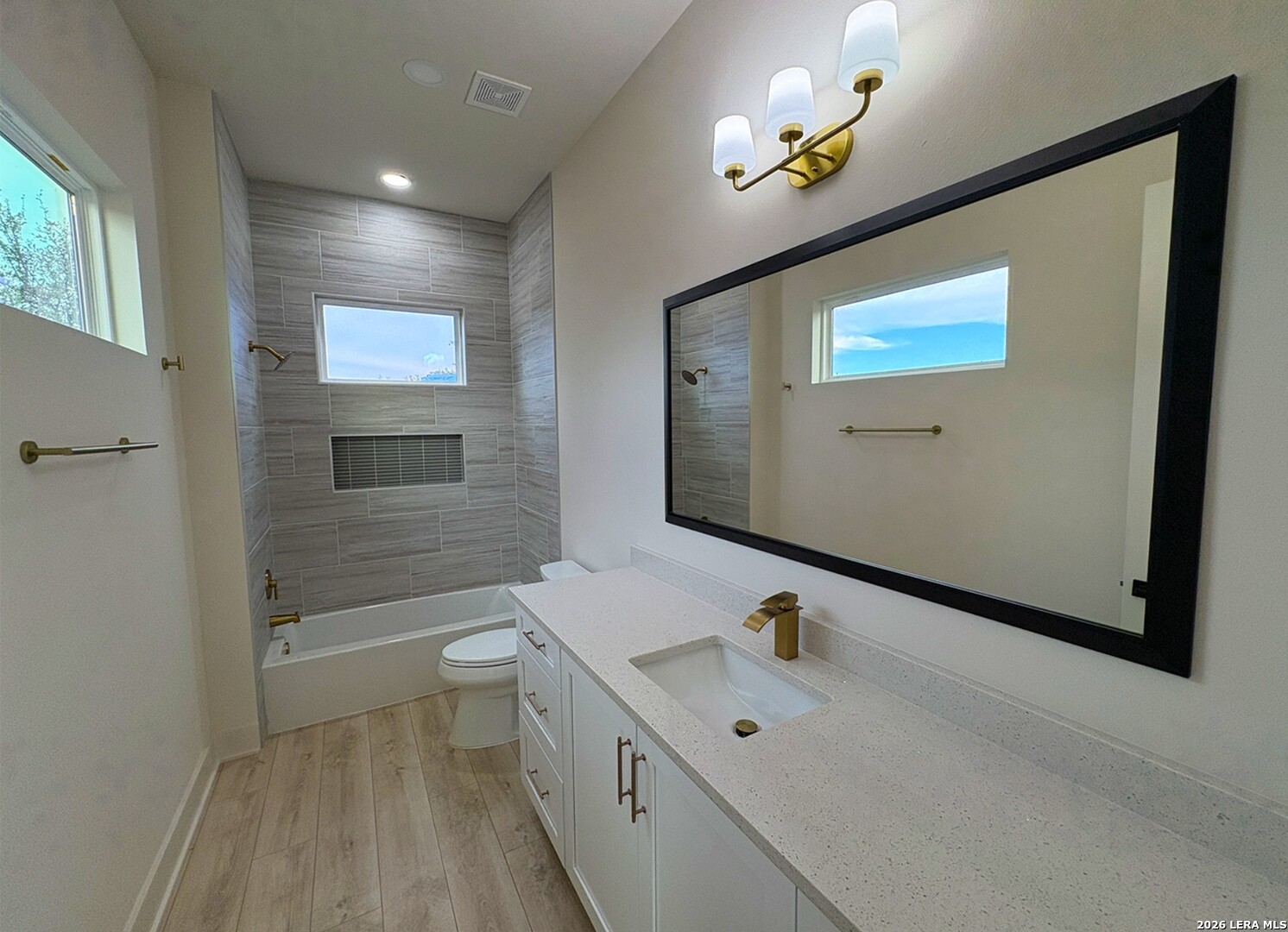 11010 Nina Ridge San Antonio, TX 78255 - Photo 37 of 44 a bathroom with a sink a toilet and a bathtub