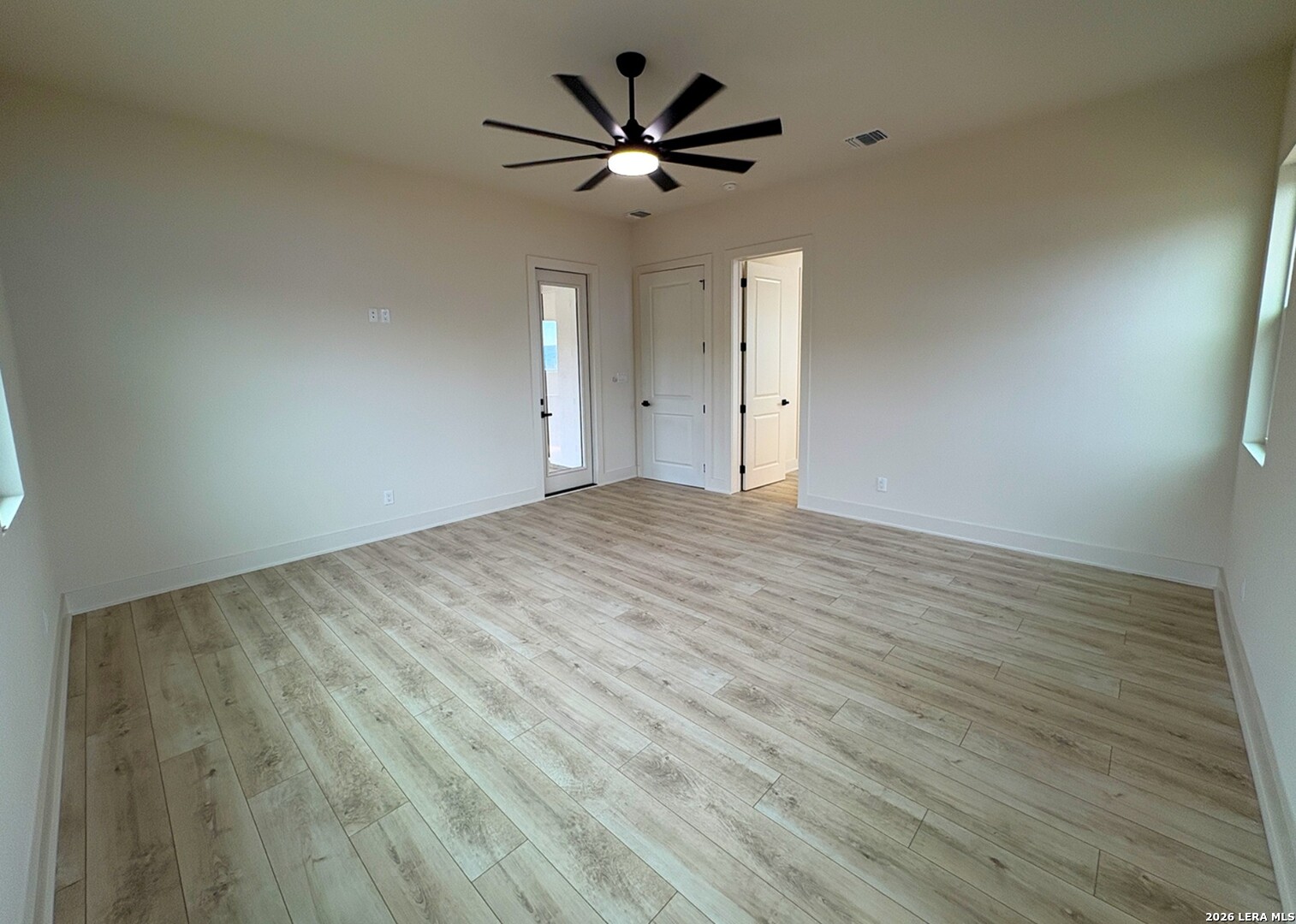 11010 Nina Ridge San Antonio, TX 78255 - Photo 38 of 44 a view of an empty room with a ceiling fan