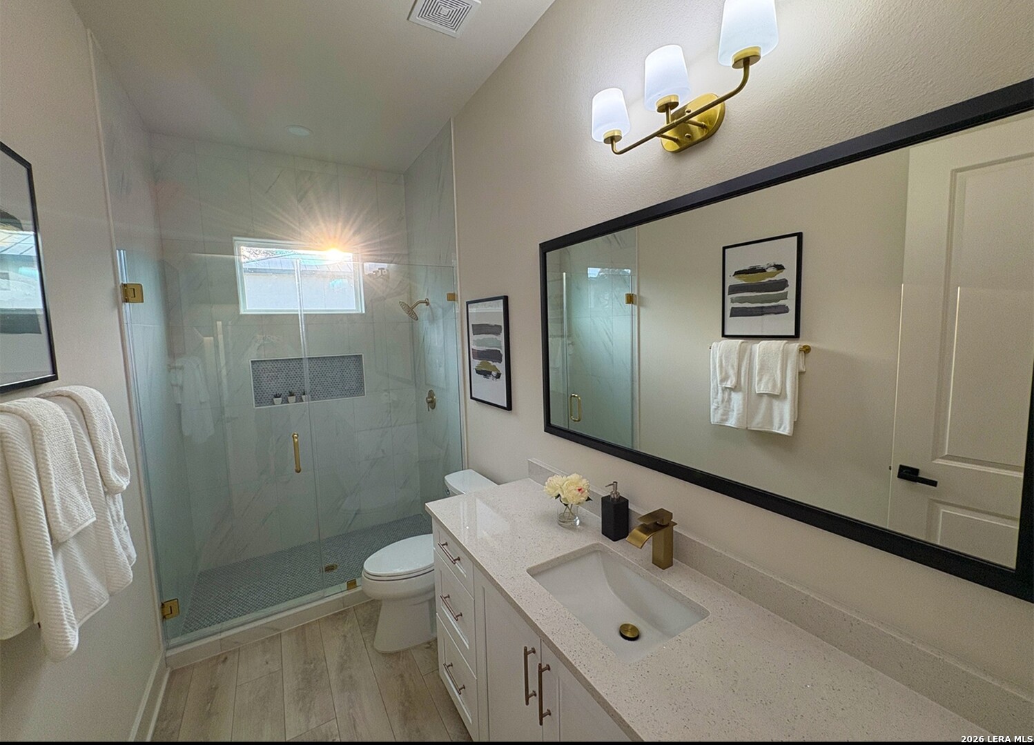 11010 Nina Ridge San Antonio, TX 78255 - Photo 42 of 44 a bathroom with a sink a toilet and shower