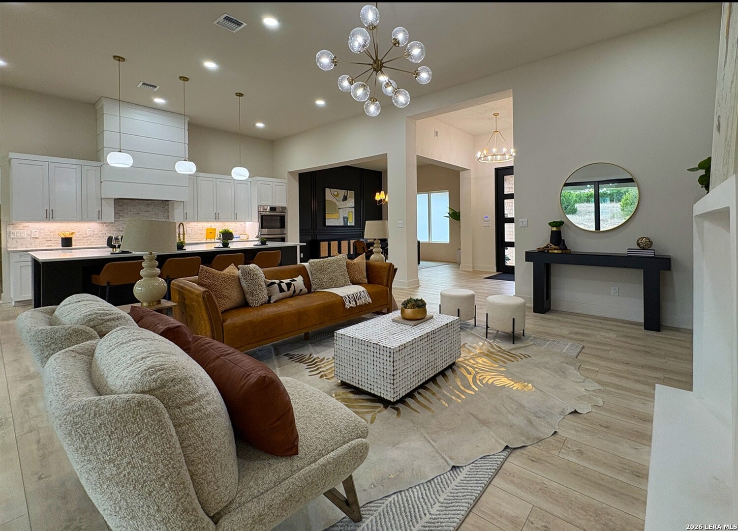 11010 Nina Ridge San Antonio, TX 78255 - Photo 9 of 44 a living room with fireplace furniture and a wooden floor