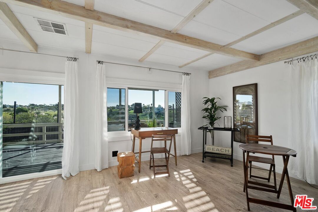 29500 Heathercliff Road, Unit SPC 103 Malibu, CA 90265 - Photo 4 of 15 a living room with furniture and a window