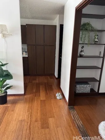 an entryway with wooden floor