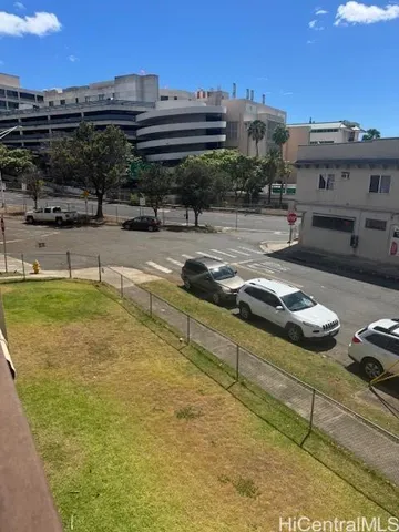 a view of a swimming pool with a lawn chairs and potted plants