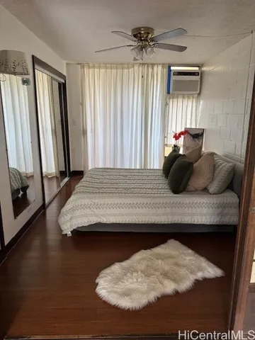 a living room with hard wood floors