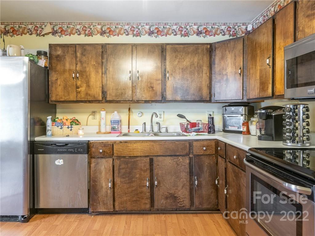 162 Alex Road Cleveland, NC 27013 - Photo 11 of 30 a kitchen with cabinets a sink and appliances