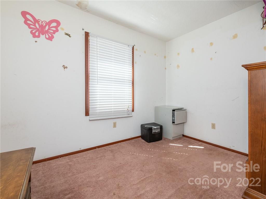162 Alex Road Cleveland, NC 27013 - Photo 19 of 30 a view of an empty room with a window