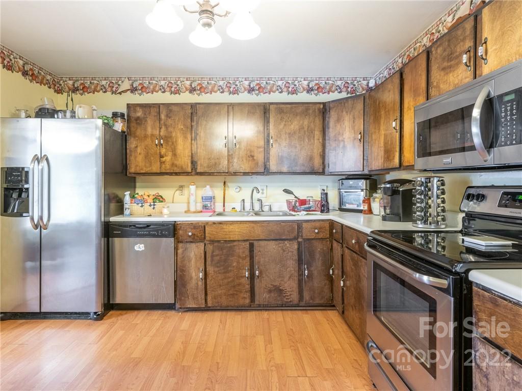 162 Alex Road Cleveland, NC 27013 - Photo 2 of 30 a kitchen with stainless steel appliances granite countertop a refrigerator and a stove