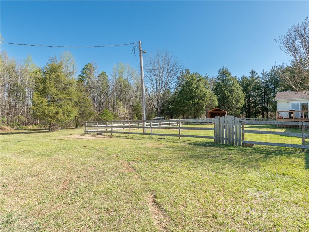 162 Alex Road Cleveland, NC 27013 - Photo 22 of 30 a view of a swimming pool with an outdoor space and seating area