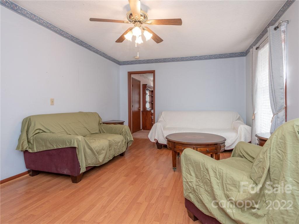 162 Alex Road Cleveland, NC 27013 - Photo 9 of 30 a living room with furniture and a wooden floor