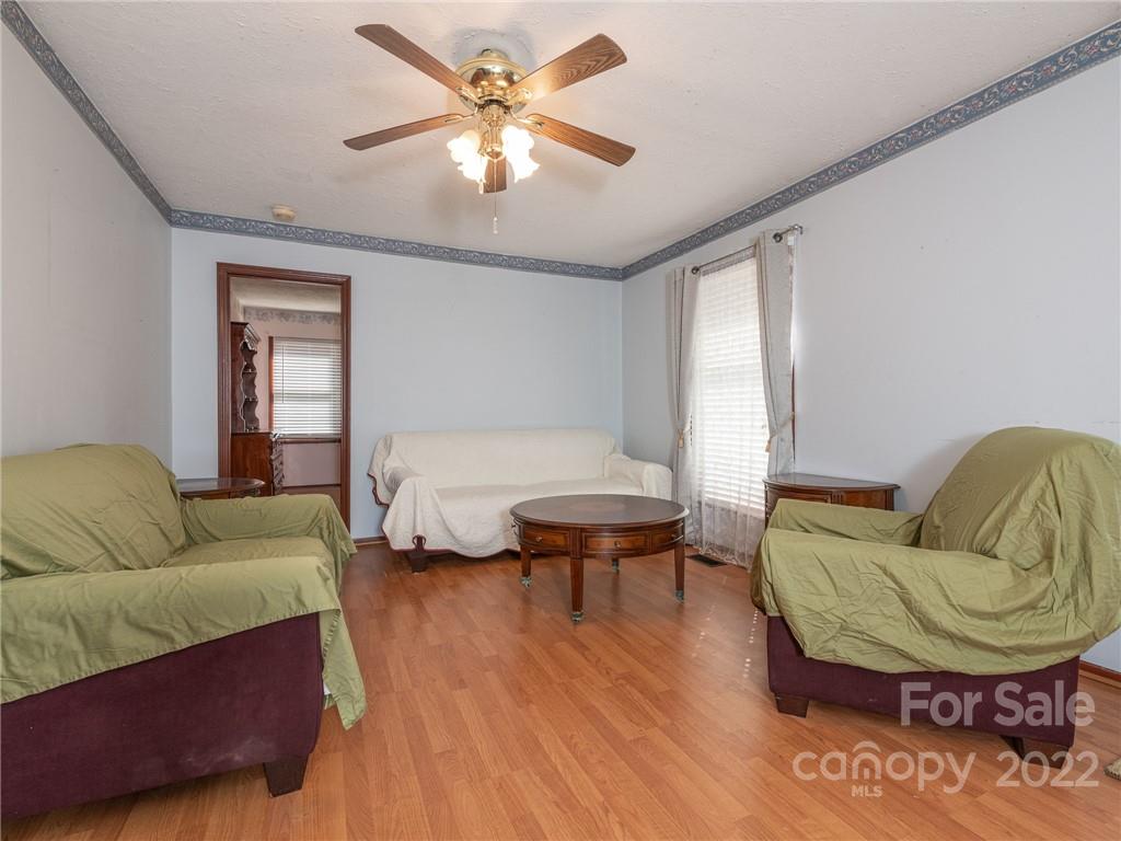 162 Alex Road Cleveland, NC 27013 - Photo 10 of 30 a living room with furniture and a wooden floor