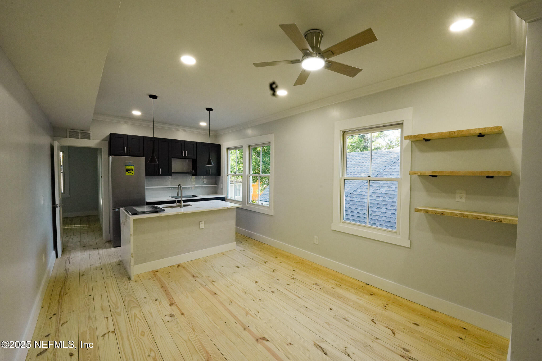 1932 Hubbard Street, Unit 1 Jacksonville, FL 32206 - Photo 4 of 5 a large kitchen with stainless steel appliances a large counter top a stove and a refrigerator
