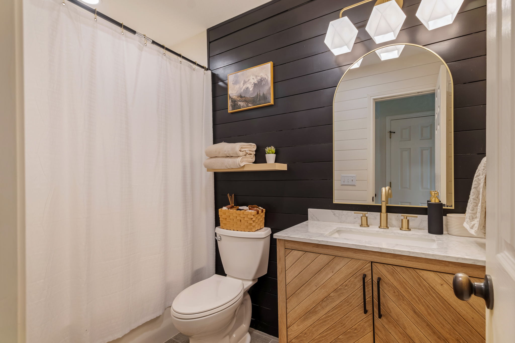 164 Johnnys Way Kyle, TX 78640 - Photo 17 of 24 a bathroom with a sink a toilet and a mirror