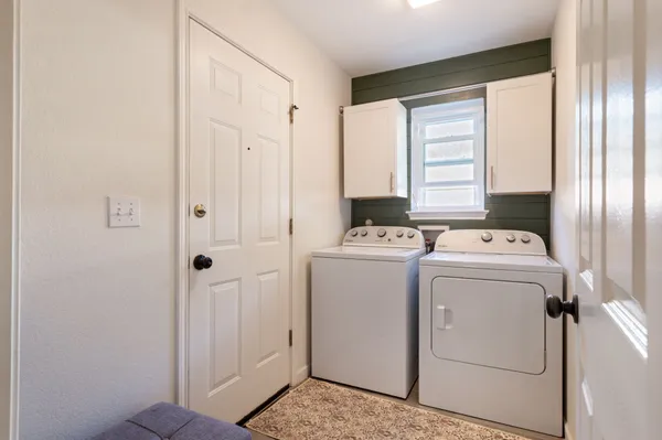 a view of storage and utility room with washer and dryer