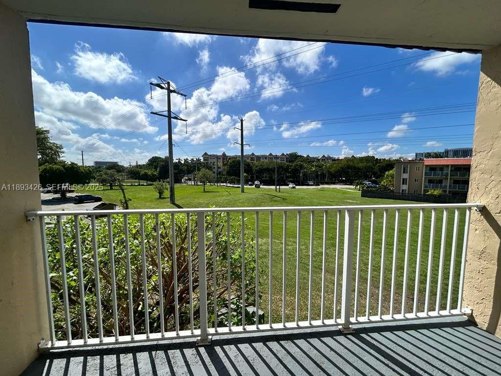 4920 Northwest 79th Avenue, Unit 307 Doral, FL 33166 - Photo 13 of 21 a view of a city skyline from a balcony