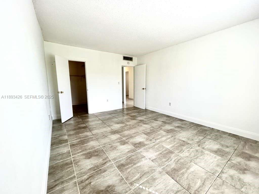 4920 Northwest 79th Avenue, Unit 307 Doral, FL 33166 - Photo 17 of 21 a view of an empty room