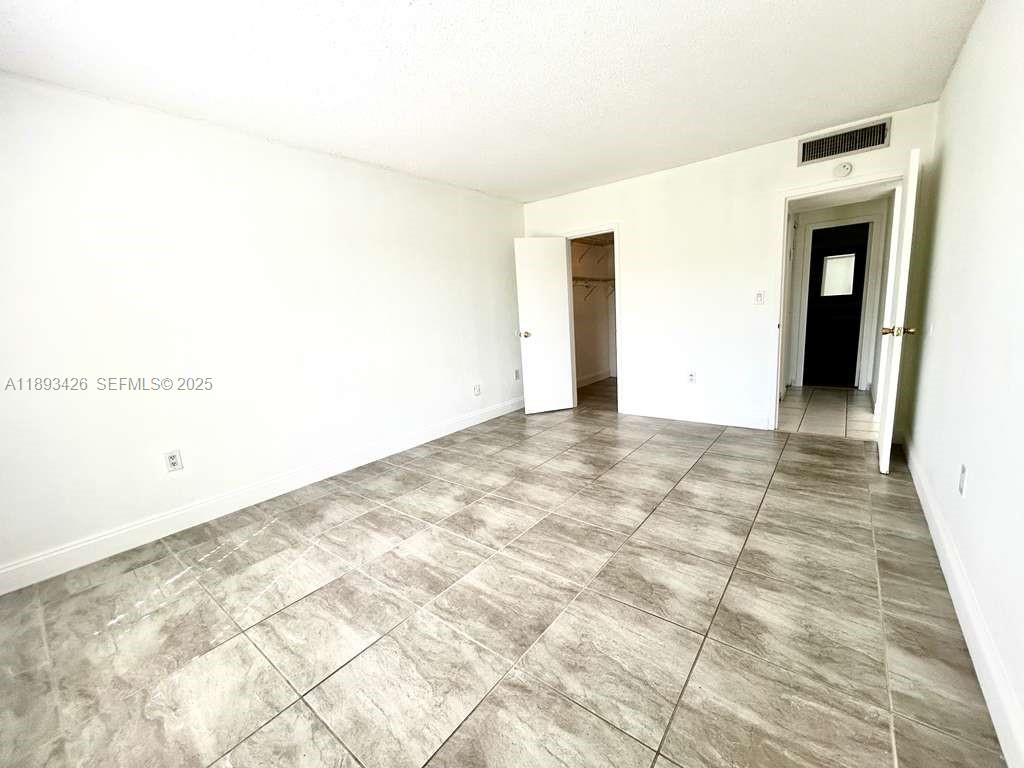 4920 Northwest 79th Avenue, Unit 307 Doral, FL 33166 - Photo 18 of 21 a view of an empty room