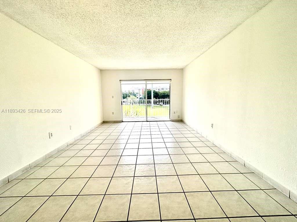 4920 Northwest 79th Avenue, Unit 307 Doral, FL 33166 - Photo 7 of 21 a view of an empty room