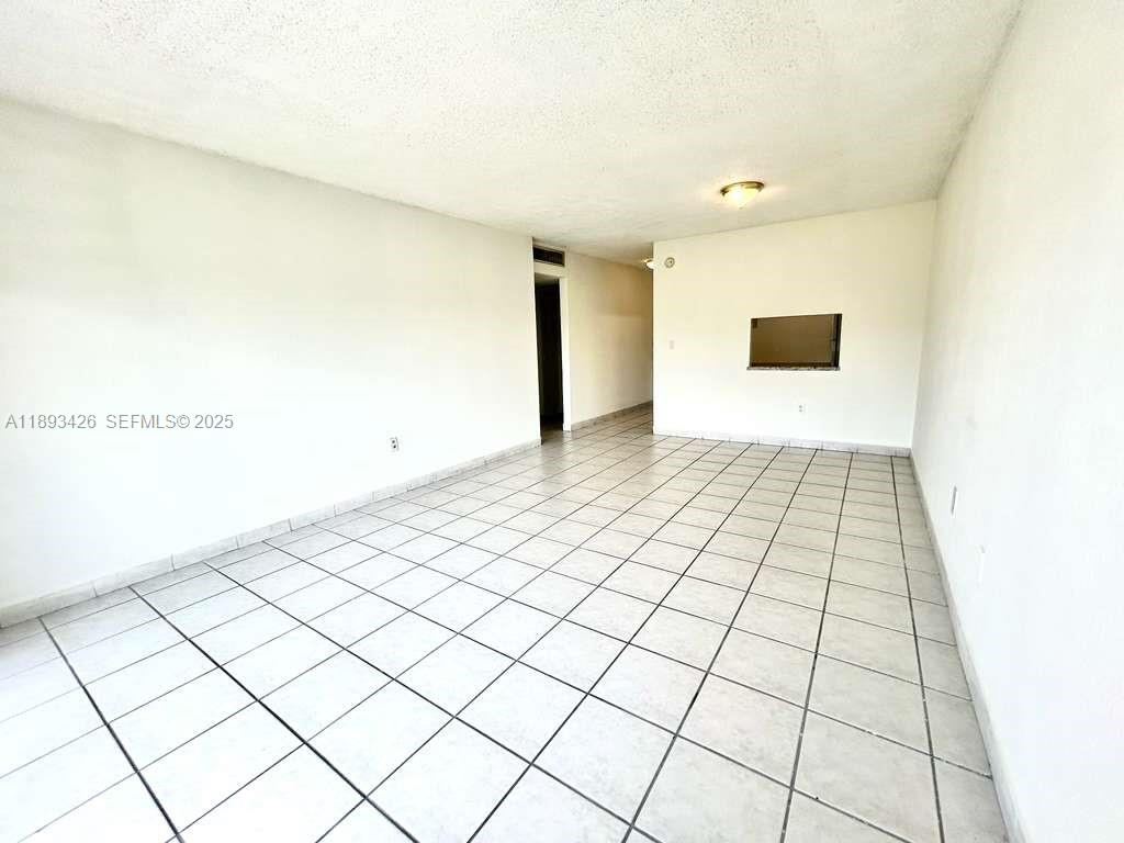 4920 Northwest 79th Avenue, Unit 307 Doral, FL 33166 - Photo 9 of 21 a view of an empty room