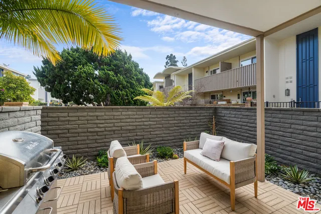 a backyard of a house with seating space