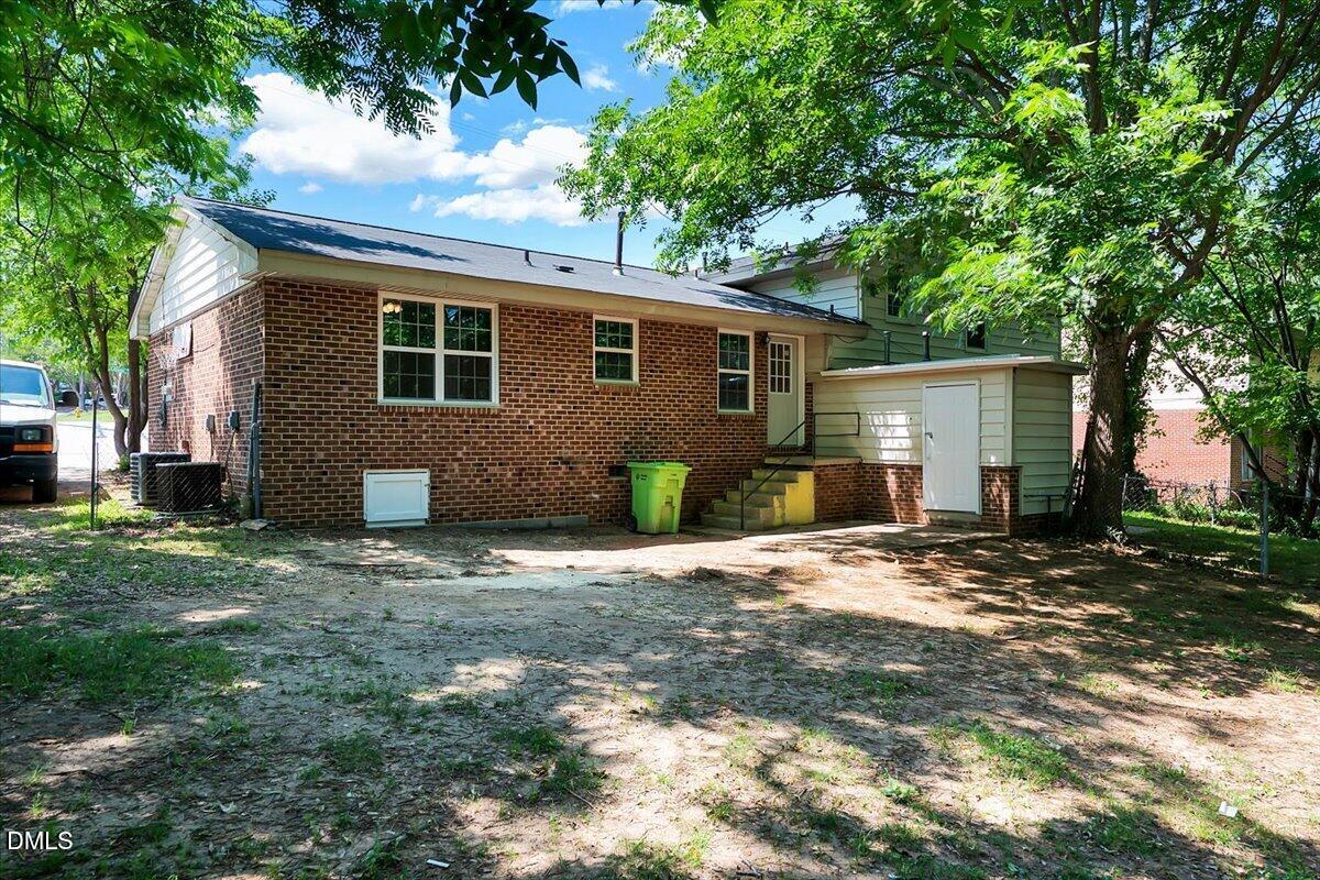 3408 Atlantic Avenue Raleigh, NC 27604 - Photo 20 of 48 a front view of a house with a yard and garage
