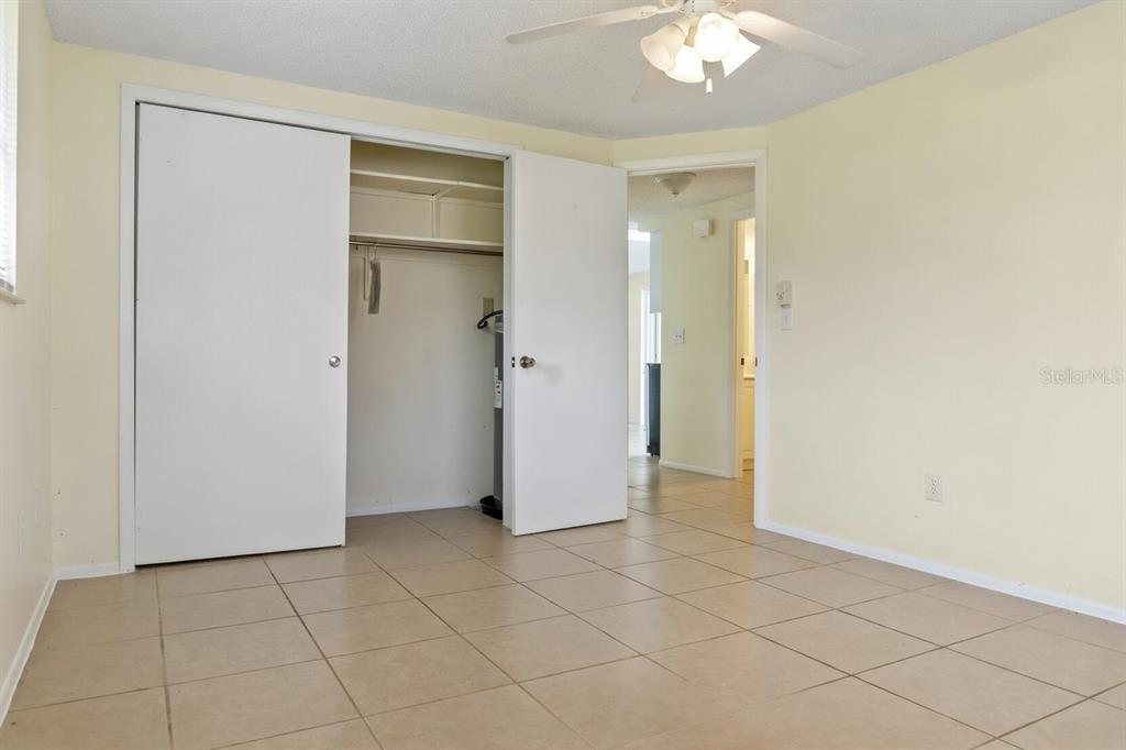 340 Periwinkle Road Venice, FL 34293 - Photo 17 of 36 wooden floor in an empty room with a bathroom