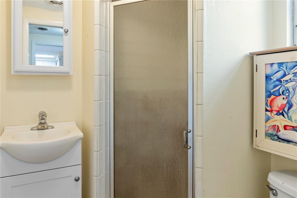 340 Periwinkle Road Venice, FL 34293 - Photo 20 of 36 a bathroom with a sink and a mirror