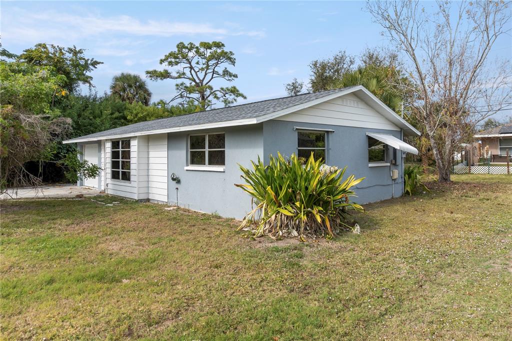 340 Periwinkle Road Venice, FL 34293 - Photo 28 of 36 a view of a house with a yard