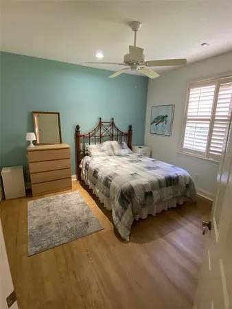 a bedroom with a bed and window